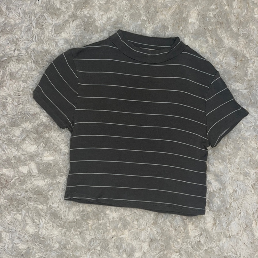 This is a very soft crop top that’s a very muted olive green
